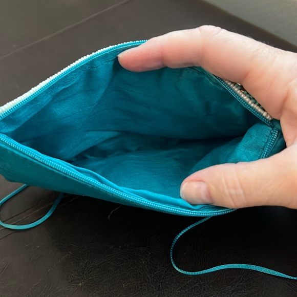 crossbody or clutch. zippered part to hold money/cards. Top slip for phone. - Picture 2 of 4